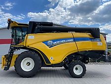 New Holland CX 5.80 inkl. 6,10m Varifeed & Wagen